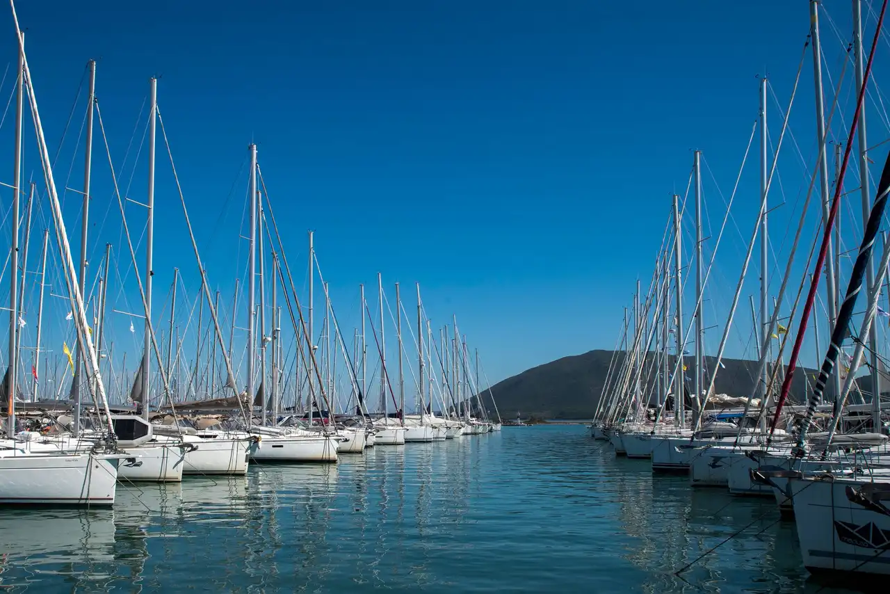 Sailing yachts moored along the pontoons of a Greek marina